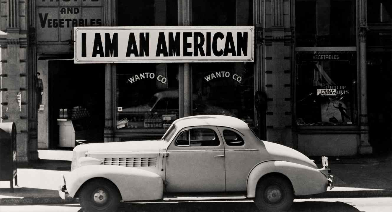 Dorothea Lange A large sign reading “I am an American” placed in the window of a store the day after Pearl Harbor. Oakland, California, 1942 The New York Public Library | Library of Congress Prints and Photographs Division Washington